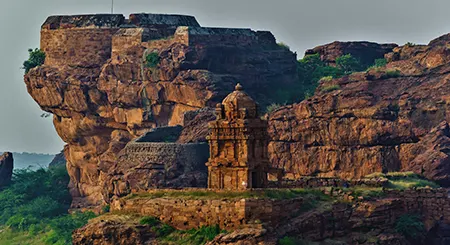 Badami tourism showcasing cave temples, red sandstone cliffs, and heritage travel