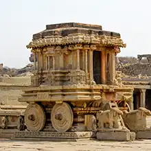 Hampi heritage tour featuring UNESCO ruins, ancient temples, stone chariots, and historic travel trails
