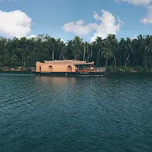 Alleppey backwaters houseboat tour with palm canals, serene waters, and relaxing Kerala holidays