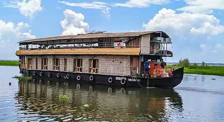 Alleppey Kerala backwaters tour featuring houseboats, canals, coconut palms, and tranquil travel moments