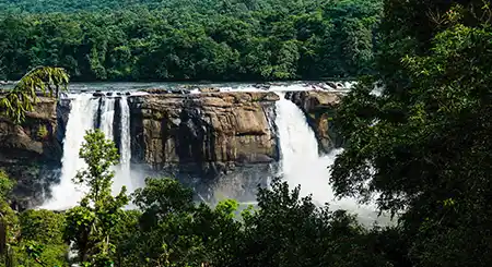 Athirapally Falls Kerala nature trip showcasing majestic waterfalls, forests, and scenic travel trails