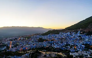 Morocco tour package showcasing imperial cities, Chefchaouen and Agafay Desert landscapes with cultural experiences