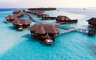 Maldives holiday package featuring Centara Ras Fushi beachfront resort stay