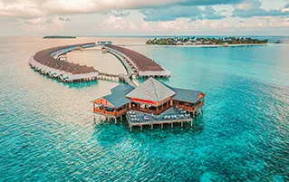 Luxury Maldives travel package at Cinnamon Velifushi overwater villa resort