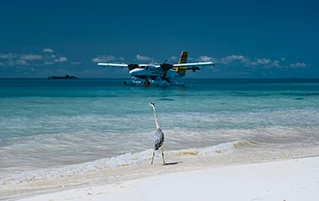Luxury Maldives holiday tour package featuring Radisson Blu overwater villa escape