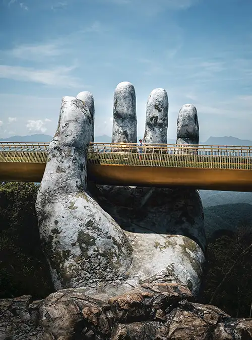 Da Nang Golden Bridge travel showcasing iconic hands structure scenic mountain tourism attraction