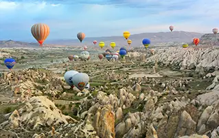 Turkey travel package showcasing Cappadocia fairy chimneys and Antalya Mediterranean beauty